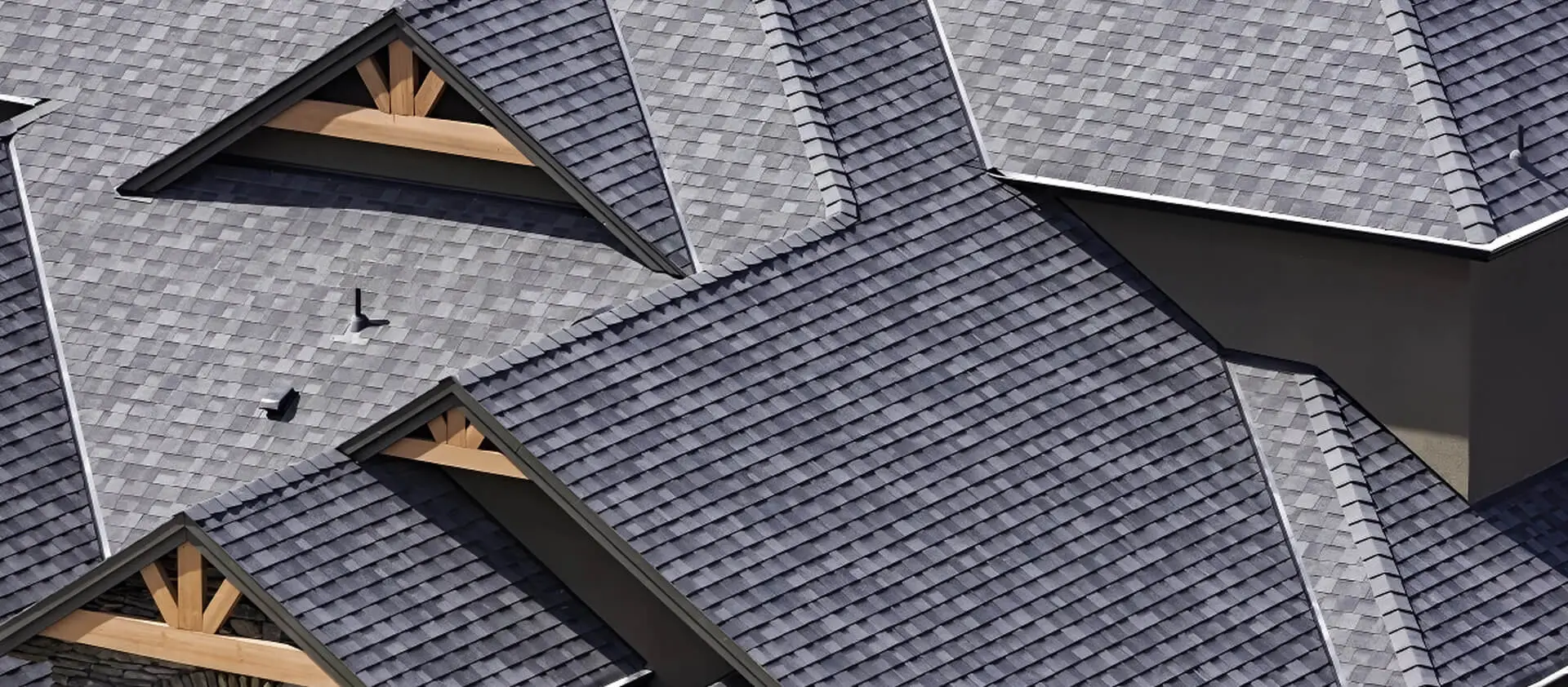 Rooftop in a Newly Constructed Subdivision Showing Asphalt Shingles and Multiple Roof Lines